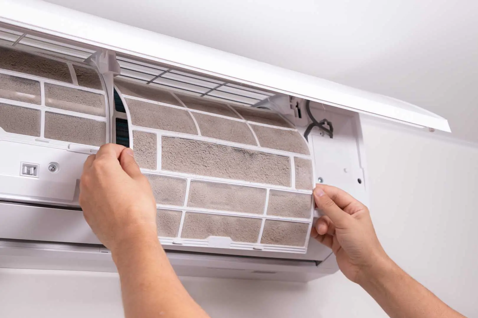 Man,Hand,Removing,Clogged,Air,Conditioner,Filter,Covered,In,Dust